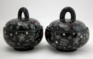 two black doodle bowls
